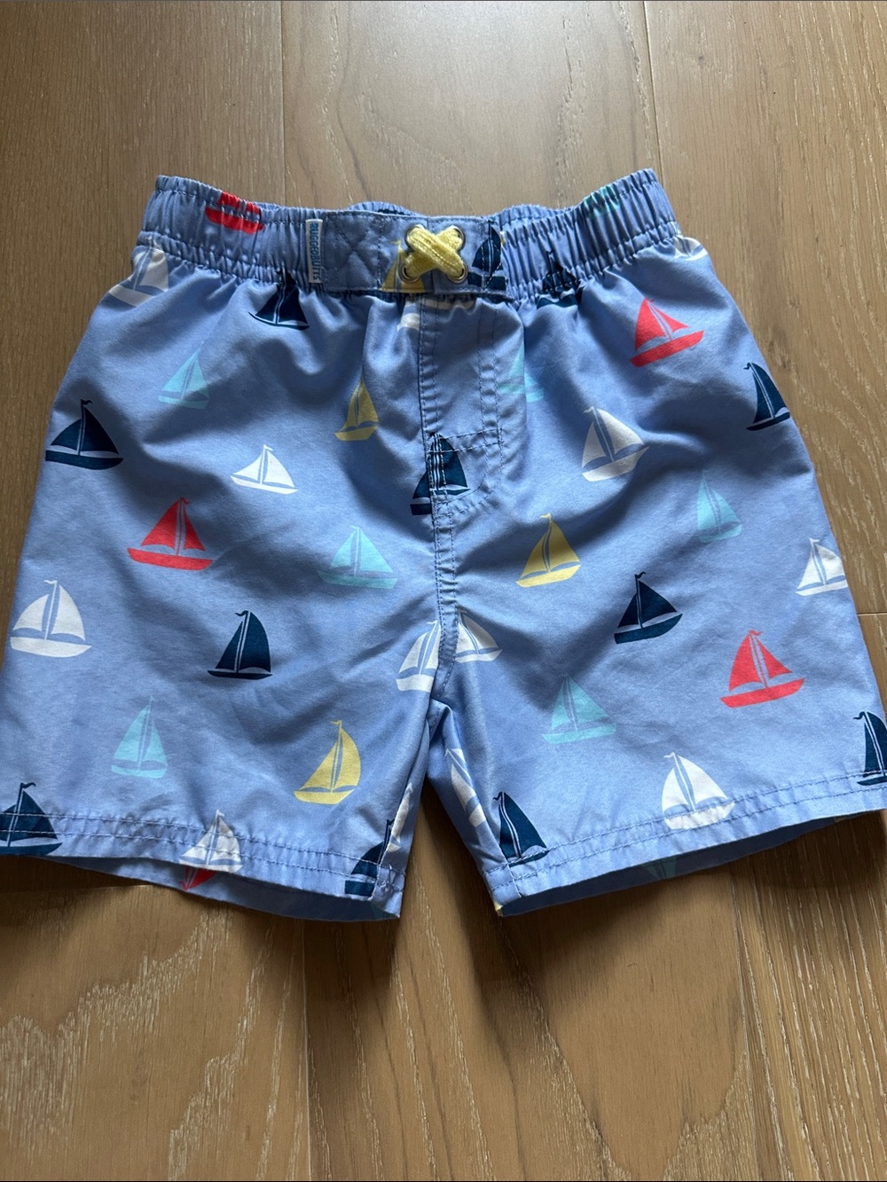 Rugged Butts Light Blue Boys' Swim Trunks with Colorful Sailboats